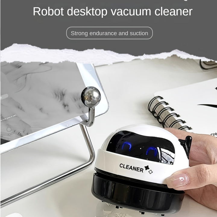 Mini Robot Desktop Vacuum Cleaner USB Rechargeable with Strong Suction Portable Handheld Cleaner for Keyboard and Pencil Shavings Includes Cleaning Brush Push Button Control Plastic Material